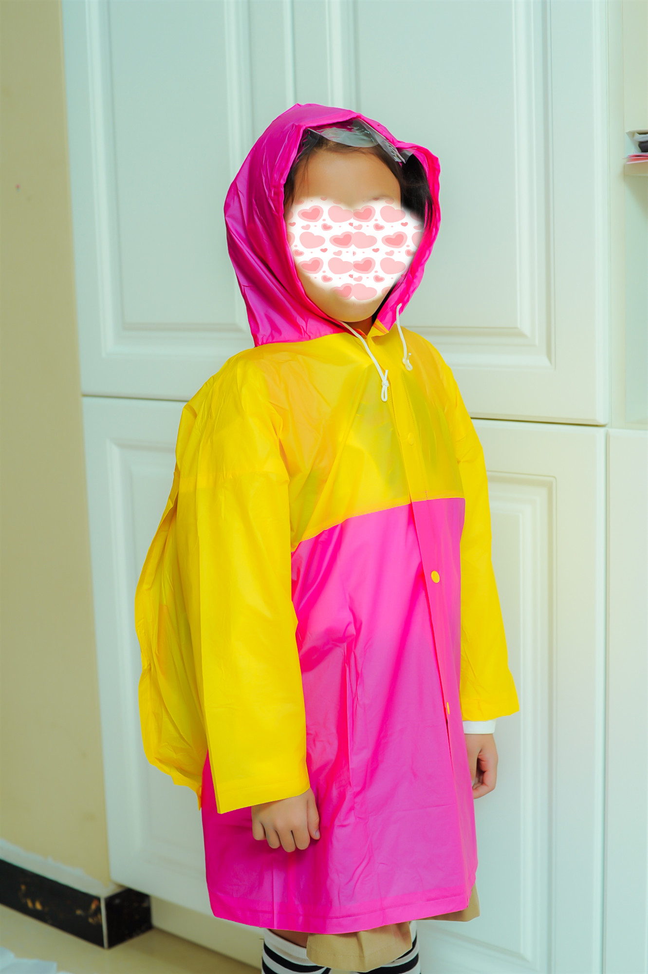 Cheap color matching plastic raincoat with backpack for children